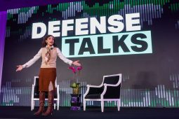 Katie Arrington delivers a keynote at DefenseTalks in December 2025. (DefenseScoop)